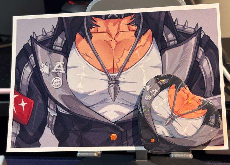 Manato postcard and pin